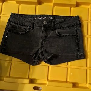 American eagle black women shorts size 6 with badizzle on them . Like new